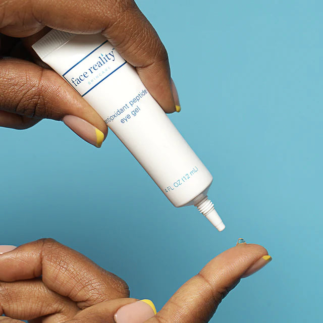 antioxidant peptide eye gel being applied to finger